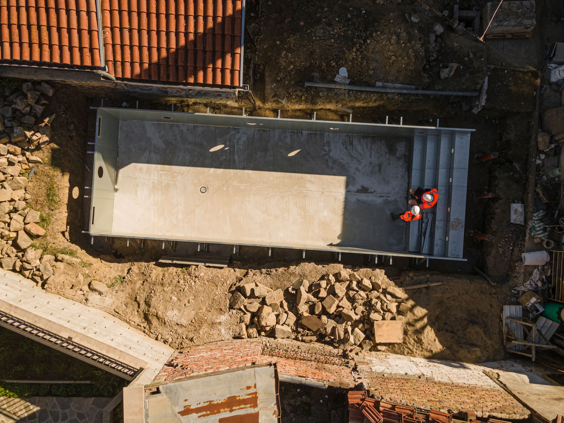 Drone View Of Construction Site of Swimming Pool With Workers